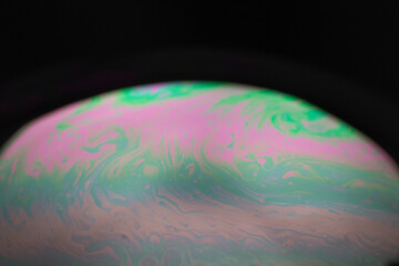 the beauty of the colorful pattern of soap bubbles is like a small planet