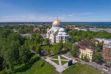 Fototapeta na wymiar Cathedral of Nicholas the Wonderworker in the cityscape on a sunny June day. Kronshtadt, Russia