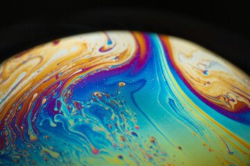 Fototapeta na wymiar the beauty of the colorful pattern of soap bubbles is like a small planet