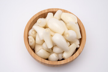 Top view of japanese shallots in wooden bowl. Healthy food