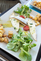Grilled sea bream fillet with potatoes