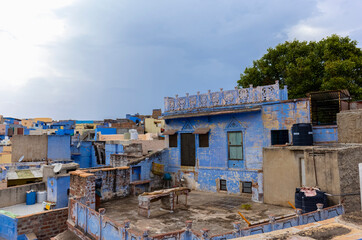Fototapeta na wymiar The bright blue color street and houses of the blue city in navchokiya of Jodhpur, Rajasthan.