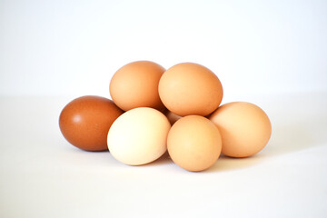 Close-up six eggs on white background, studio photo