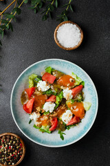 salad with fresh vegetables and peach closeup. Fresh Summer Salad with Peaches and Buratta Cheese.