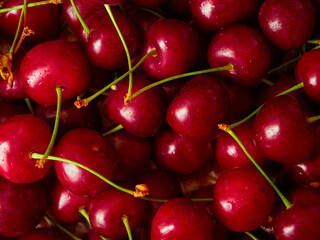 Ripe red sweet cherry close up as background