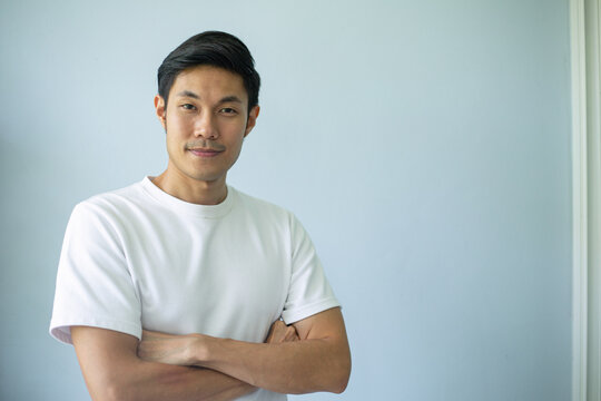 Asian man face stand and smile in the outdoor.