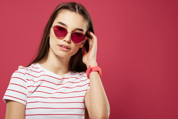 Fototapeta premium cute girl with sunglasses glamor fashion pink background