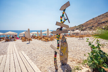 Empty wooden direction sign at the tranquil beach in albania