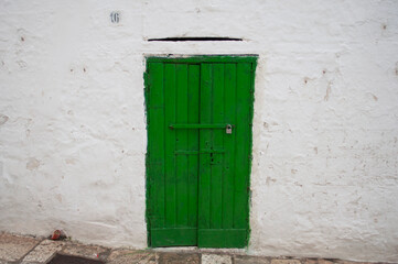 Obraz na płótnie Canvas Ancient Green Door. Ostuni, Italy