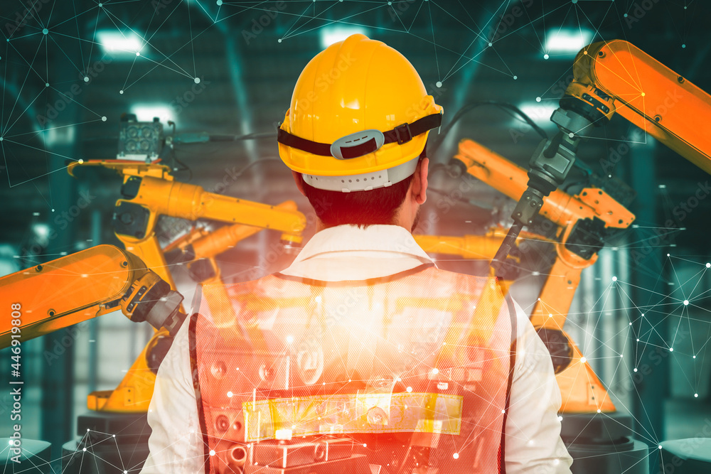 Poster mechanized industry robot arm and factory worker double exposure . concept of robotics technology fo