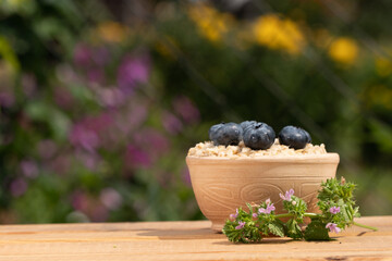 Breakfast cereals in bowl served with  and blueberries. Clean eating, healthy food diet concept