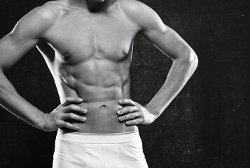 Obraz na płótnie Canvas sporty man in white panties pumped up body workout motivation