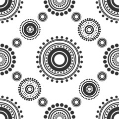 Seamless abstract pattern of black circles and dots on white background. Kaleidoscope ornament.