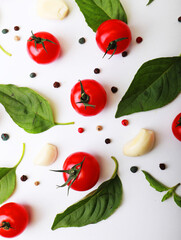 Tomato, basil, spices, pepper, garlic. Vegan diet food, creative cherry tomato composition