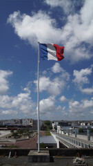 flag on the pier in the sky with clouds, Montoir St Nazaire, Bretagne, France