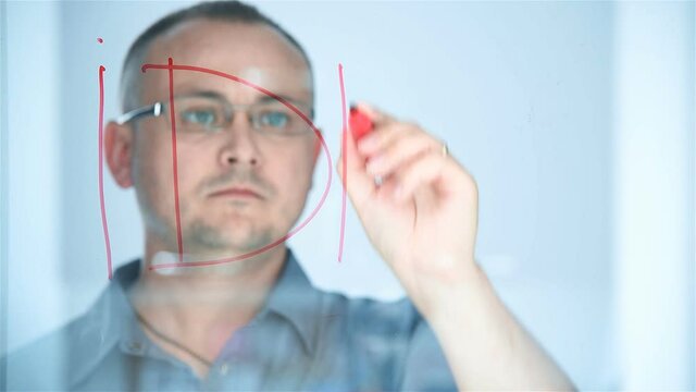 Businessman Drawing Idea Text On Glass Screen In Office. Business And Financial Success Concept. Close Up