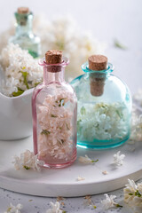 Obraz na płótnie Canvas Special flower aromatherapy for body care. Lilac aromatic oils.
