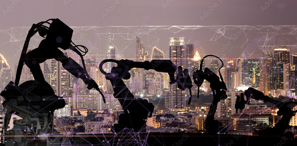 Aufkleber Silhouette of modern automation robot arms with Ai assistant technology network concept and metropolis city building background.