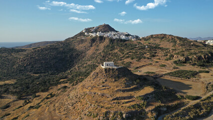 Aerial drone photo from uphill Venetian castle and small chapel overlooking the Aegean sea on top...