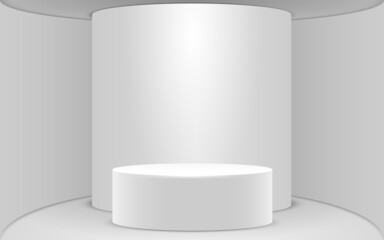 white cylinder podium in the white studio room