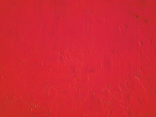 Abstract brushed background of old red stucco.