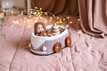 Knitting yarn balls and needles in basket on a white background