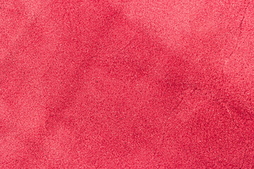 Closeup detail of red leather texture background.