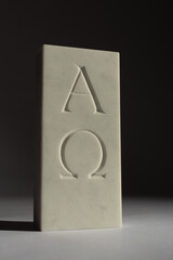 Alpha and omega, hand carved lettering on Italian marble