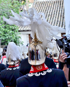 band of the procession of the Aurora being seen in the foreground the reflection in a silver helmet with feathers