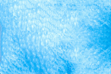 Blue transparent water surface of ocean, sea, lagoon with. Horizontal background. Aerial, drone view