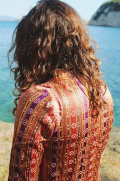 Woman of turkish ethnicity wearing old ripped traditional clothing piece of anatolian nomad culture