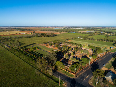 Aerial image of rural Aussie graveyard with old graves cemetery expanding over new green lawn