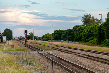 Distant train switching rails to coming into the station