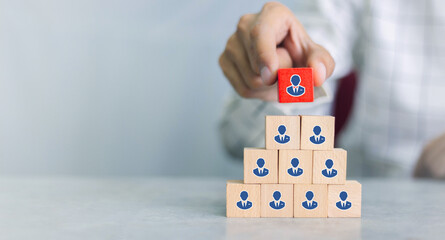 Recruiter complete team represented by wooden cube by one leader person (CEO) and icon,human...