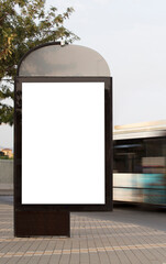 Vertical blank billboard on the city street with bus