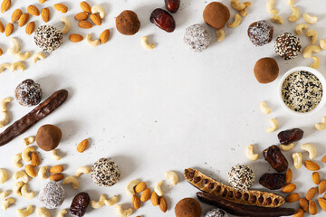 Carob energy balls with nuts, dates and coconut, vegan and vegetarian sweet food