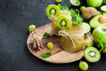 Healthy smoothie of fresh green fruits. Creative atmospheric decoration