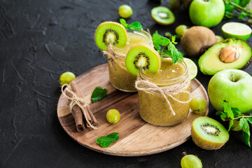 Healthy smoothie of fresh green fruits. Creative atmospheric decoration