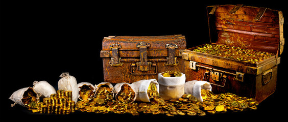 Stacking lots of gold coins in treasure chest old on black background