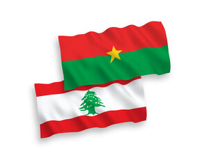 National vector fabric wave flags of Burkina Faso and Lebanon isolated on white background. 1 to 2 proportion.