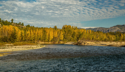 The turquoise waters of Köprüçay, a rafting center, and the yellow of autumn around it