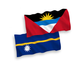 National vector fabric wave flags of Republic of Nauru and Antigua and Barbuda isolated on white background. 1 to 2 proportion.
