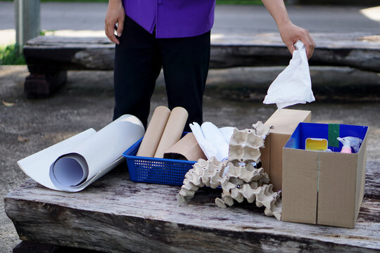 Concept : Categorize Type Of Garbage. Housekeeper Is Separating Recyclable Rubbish ; Paper, Plastic, Egg Cartons Before Throwing Away Or Selling To Local Recycle Factory.    