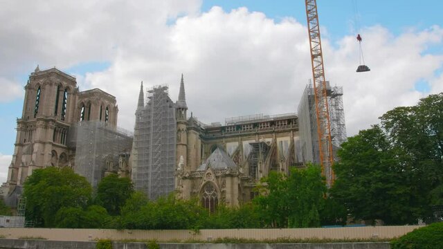 Construction Site Of Fire Damaged Building Of Notre-Dame de Paris Cathedral Being Rebuilt In Paris, France. Working crane.