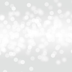 Winter light and white abstract bokeh on a bluish background