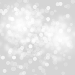 Winter light and white abstract bokeh on a bluish background