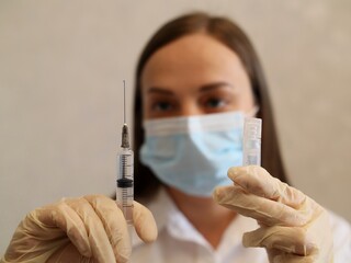 doctor with syringe, covid injection, vaccine