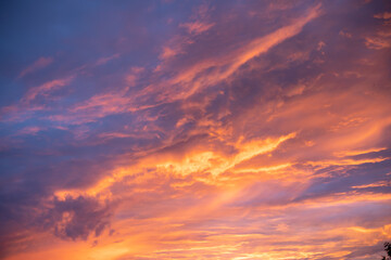 Naklejka na ściany i meble Sunny sunset in the sky Multicolored