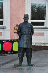 Fototapeta na wymiar Urban sculpture. Sculpture of a gendarme, policeman, 19th century. Kazan, Russia, September 10, 2020
