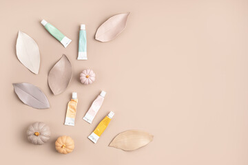 Hobby background with handmade gypsum pumpkins, paint brushes and art accessories